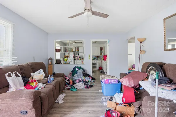 a living room with furniture toys and a flat screen tv