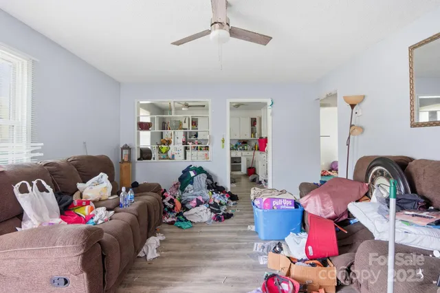 a living room with furniture toys and a flat screen tv