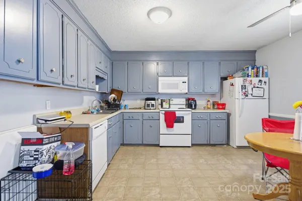a utility room with cabinets dryer and washer