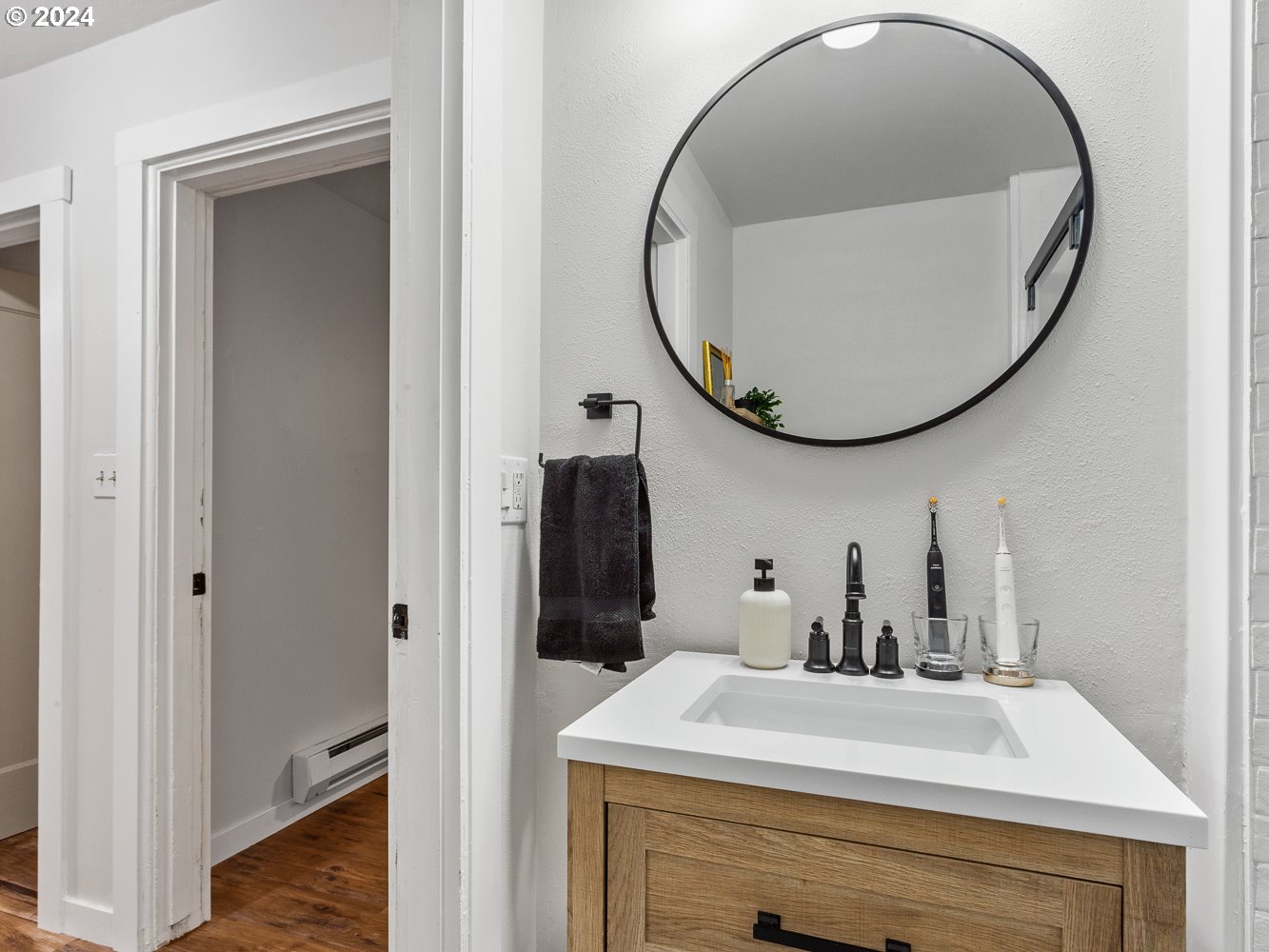 205 North 9th Avenue Ridgefield, WA 98642 - Photo 19 of 48 a bathroom with a sink and a mirror