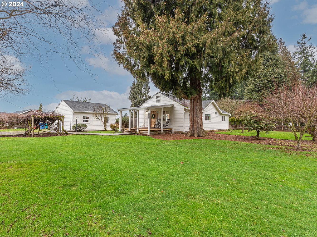 205 North 9th Avenue Ridgefield, WA 98642 - Photo 30 of 48 a view of an house with backyard space and garden