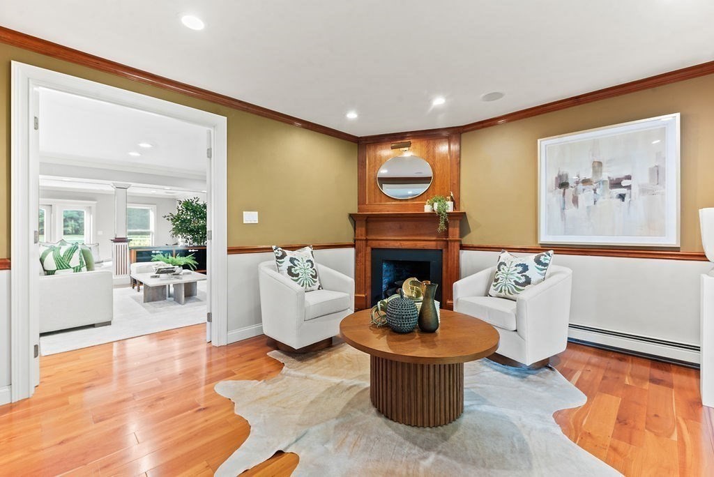 10 Stop River Road Norfolk, MA 02056 - Photo 12 of 29 a living room with furniture and a fireplace