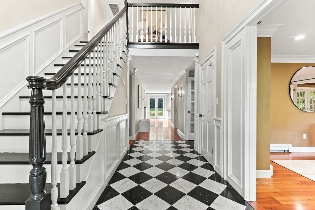 10 Stop River Road Norfolk, MA 02056 - Photo 2 of 29 a view of entryway with wooden floor and a front door