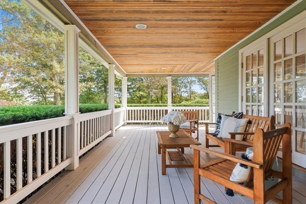 10 Stop River Road Norfolk, MA 02056 - Photo 28 of 29 a view of balcony with couch and wooden floor