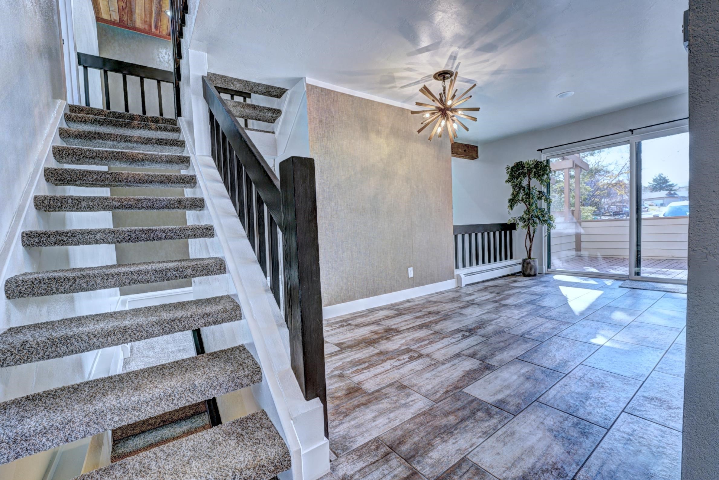 397 Ridge Cir Drive, Unit 8 Grand Junction, CO 81507 - Photo 14 of 40 a view of entryway and hall with wooden floor