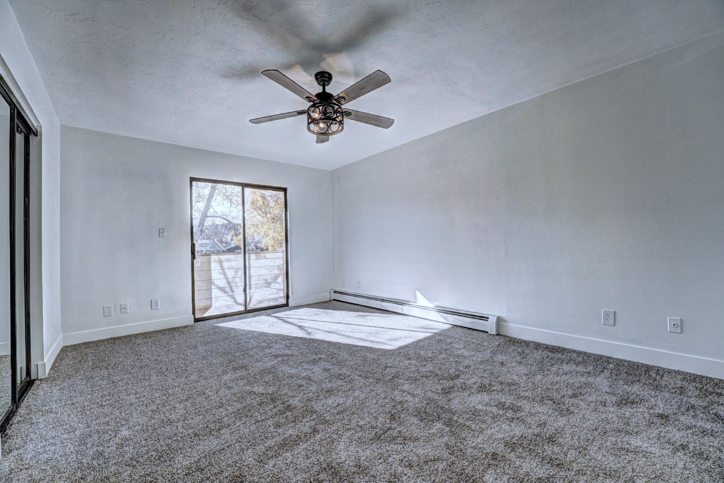 397 Ridge Cir Drive, Unit 8 Grand Junction, CO 81507 - Photo 16 of 40 a view of an empty room with a window