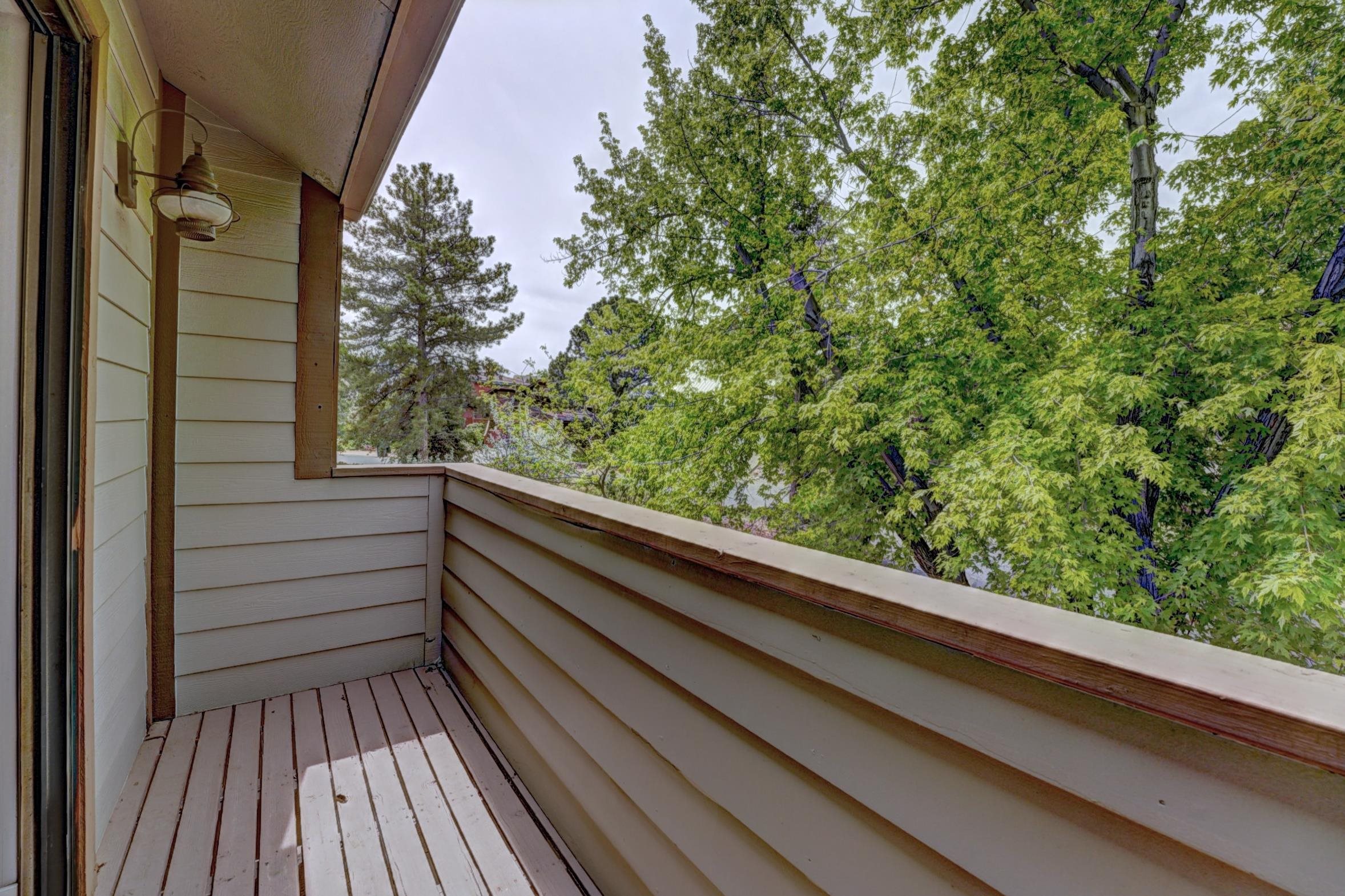 397 Ridge Cir Drive, Unit 8 Grand Junction, CO 81507 - Photo 17 of 40 a view of balcony with wooden floor and fence