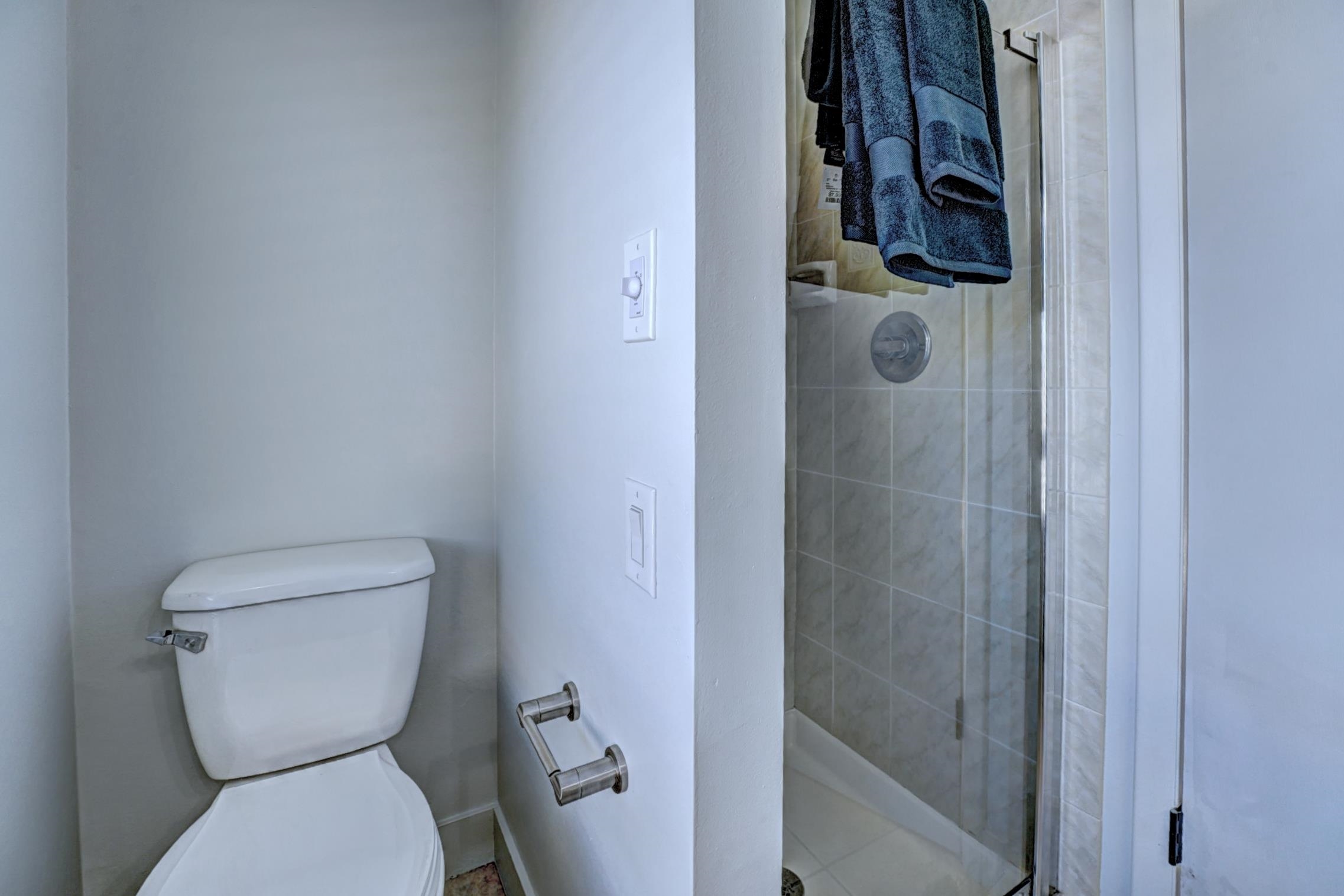 397 Ridge Cir Drive, Unit 8 Grand Junction, CO 81507 - Photo 20 of 40 a white toilet sitting next to a bathroom sink