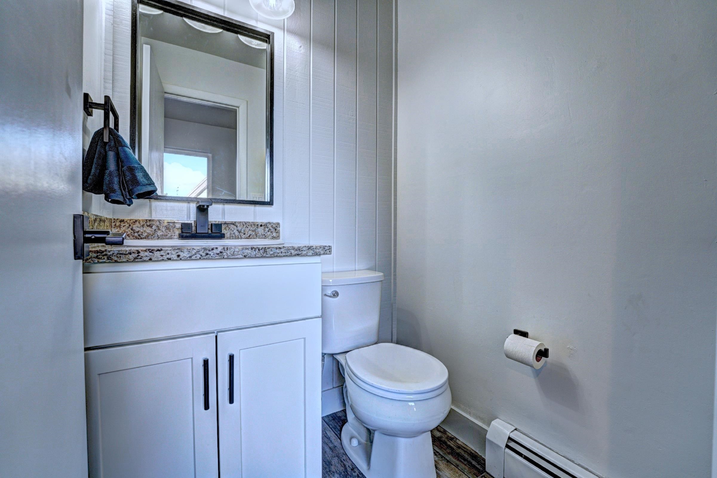 397 Ridge Cir Drive, Unit 8 Grand Junction, CO 81507 - Photo 23 of 40 a bathroom with a toilet sink and mirror