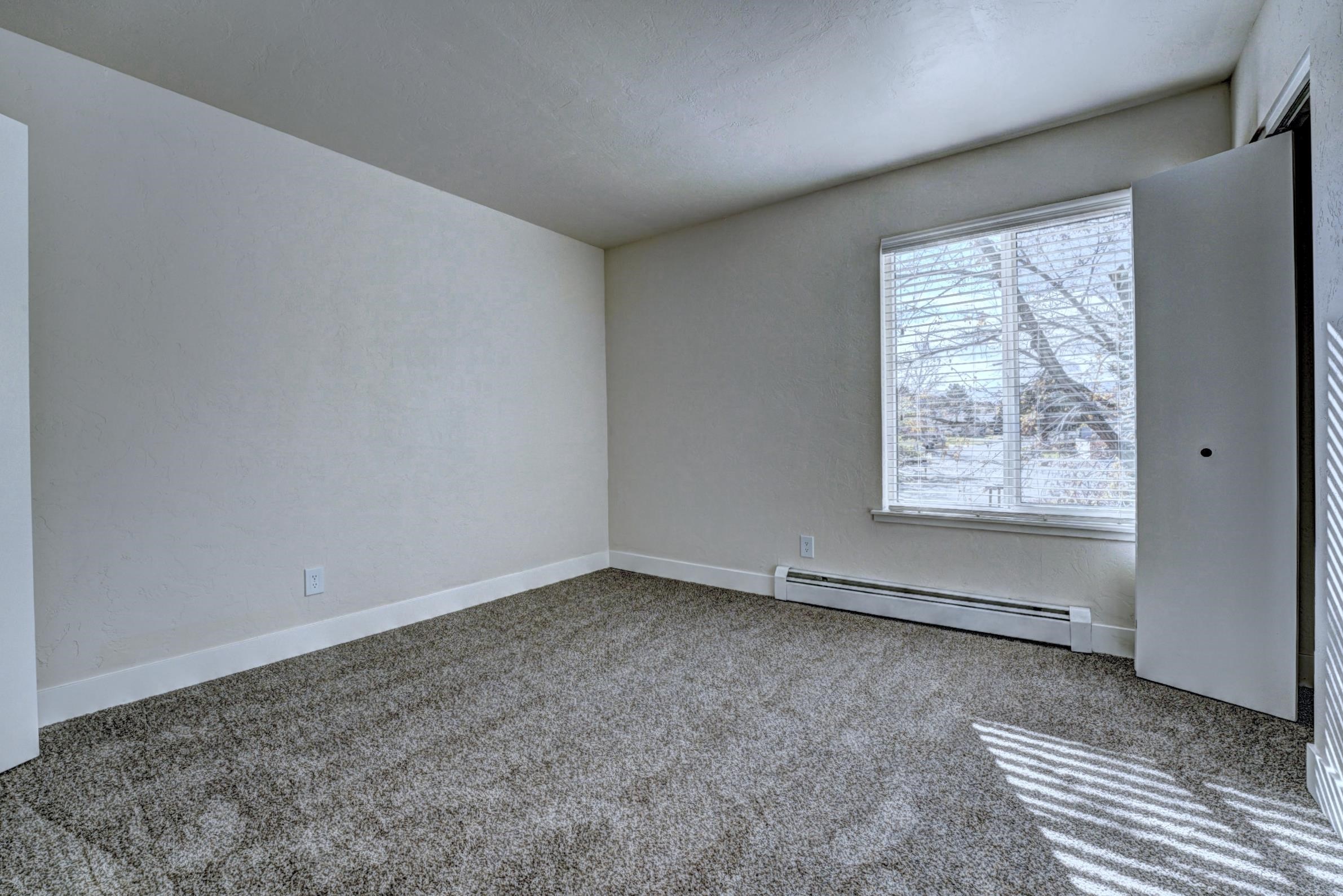 397 Ridge Cir Drive, Unit 8 Grand Junction, CO 81507 - Photo 25 of 40 an empty room with windows