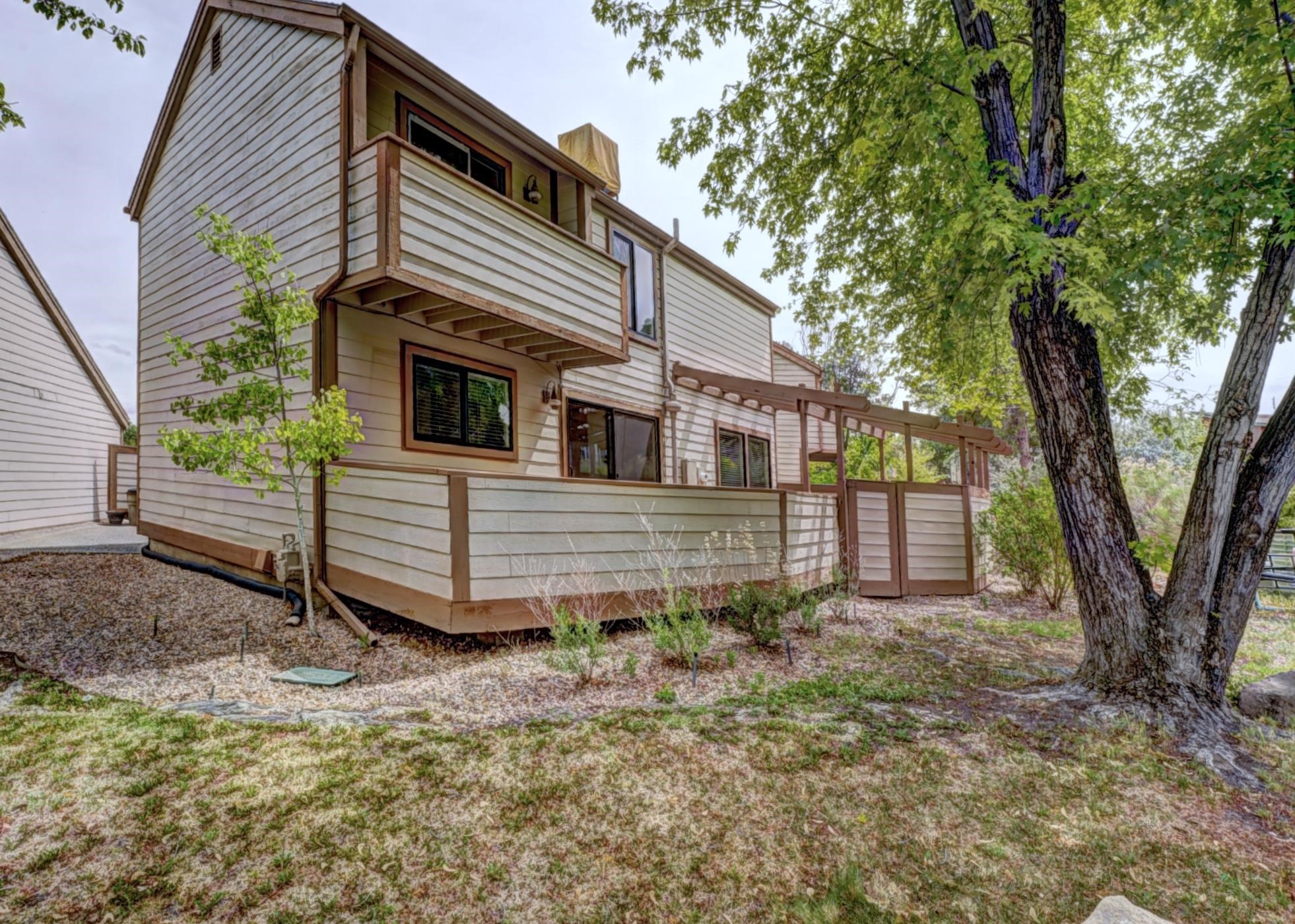 397 Ridge Cir Drive, Unit 8 Grand Junction, CO 81507 - Photo 33 of 40 a view of a house with a yard and tree