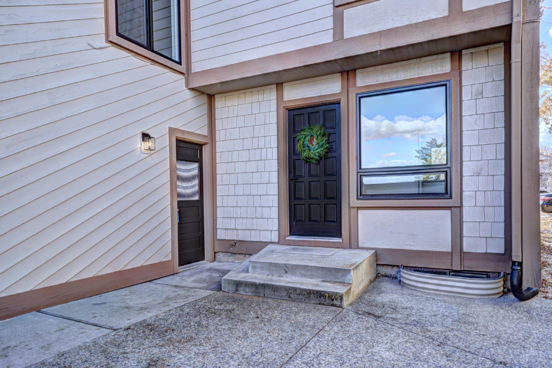 397 Ridge Cir Drive, Unit 8 Grand Junction, CO 81507 - Photo 35 of 40 a view of a house with a door and wooden walls