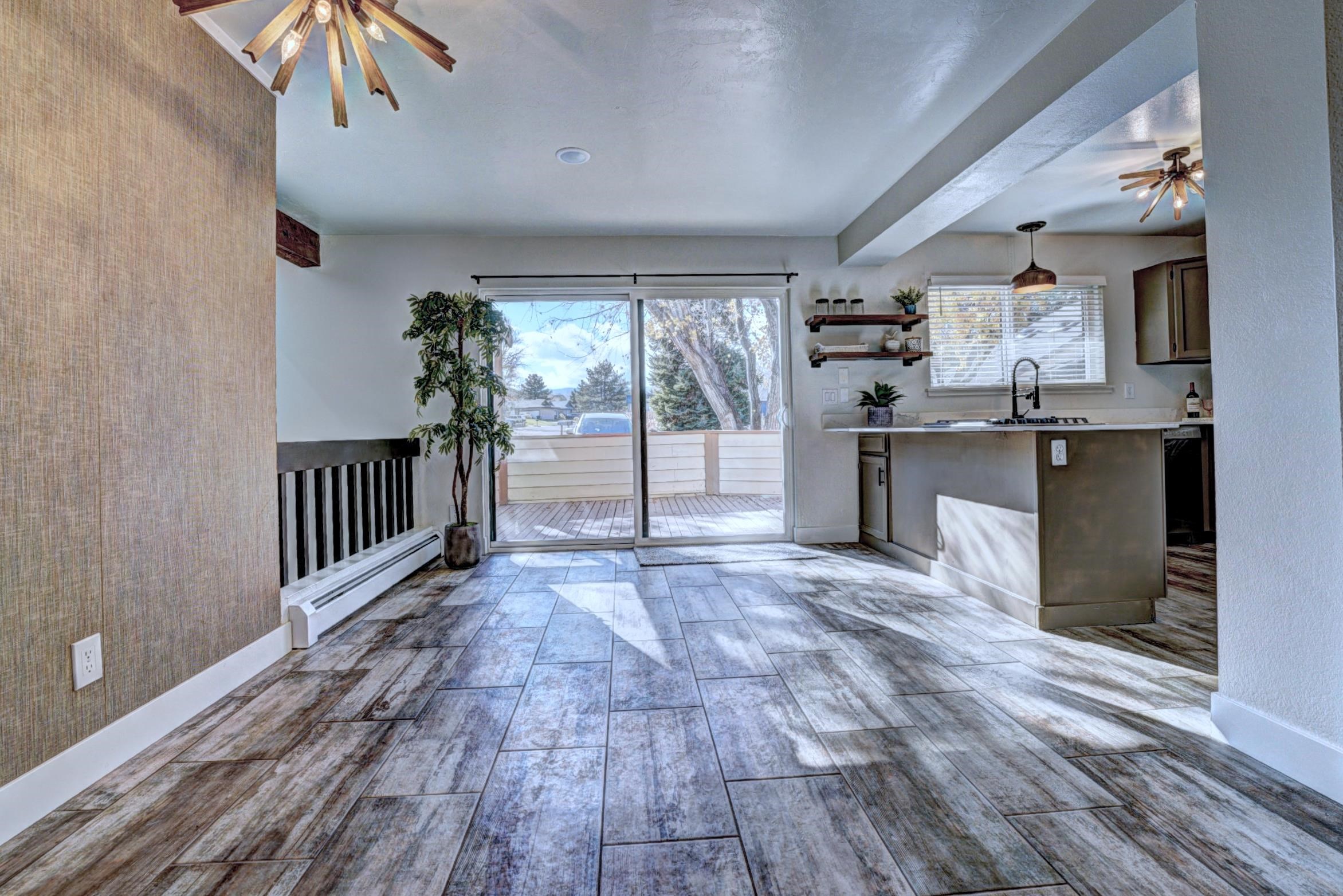397 Ridge Cir Drive, Unit 8 Grand Junction, CO 81507 - Photo 9 of 40 a view of a kitchen with cabinets and wooden floor