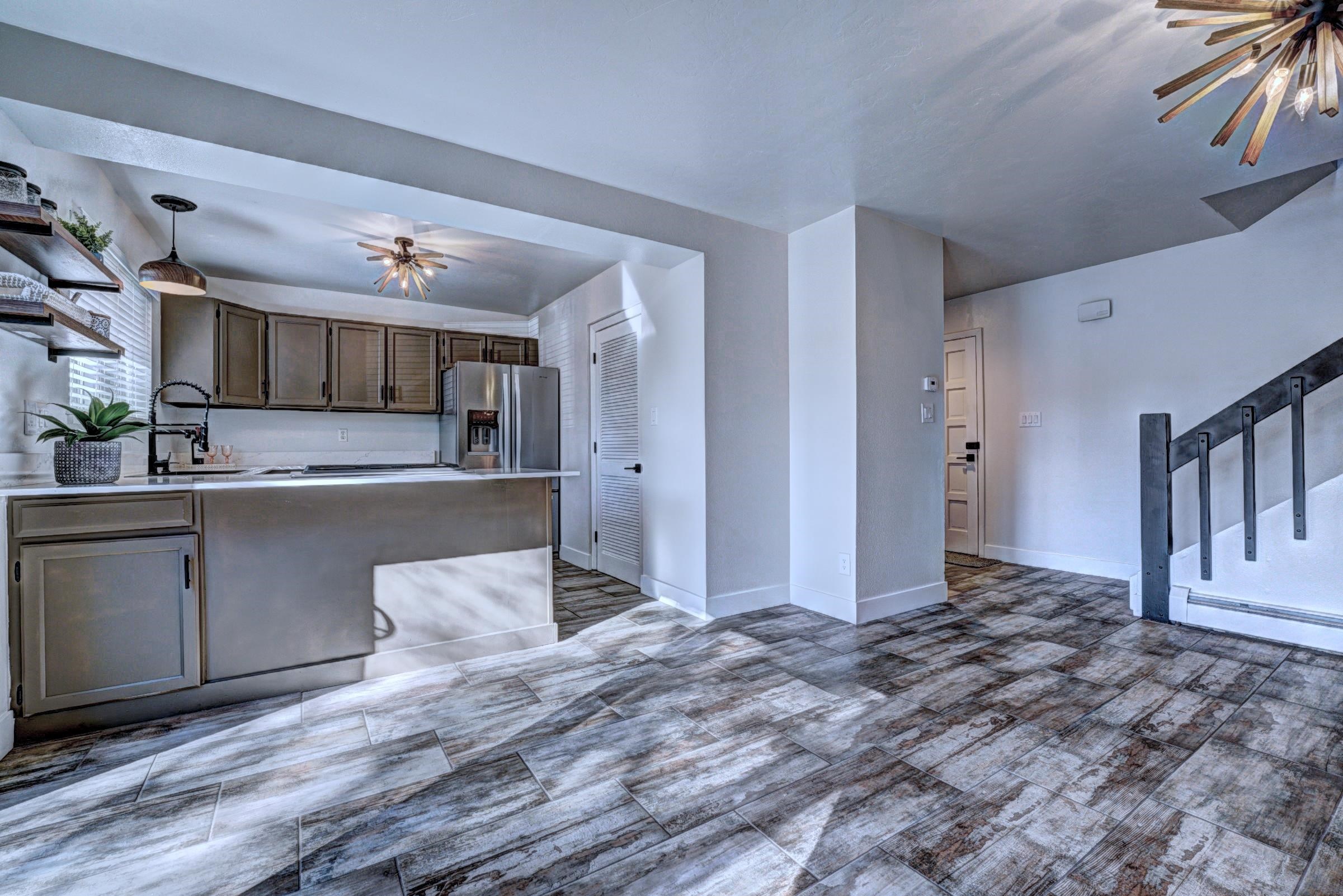 397 Ridge Cir Drive, Unit 8 Grand Junction, CO 81507 - Photo 10 of 40 a kitchen with stainless steel appliances kitchen island sink refrigerator and cabinets