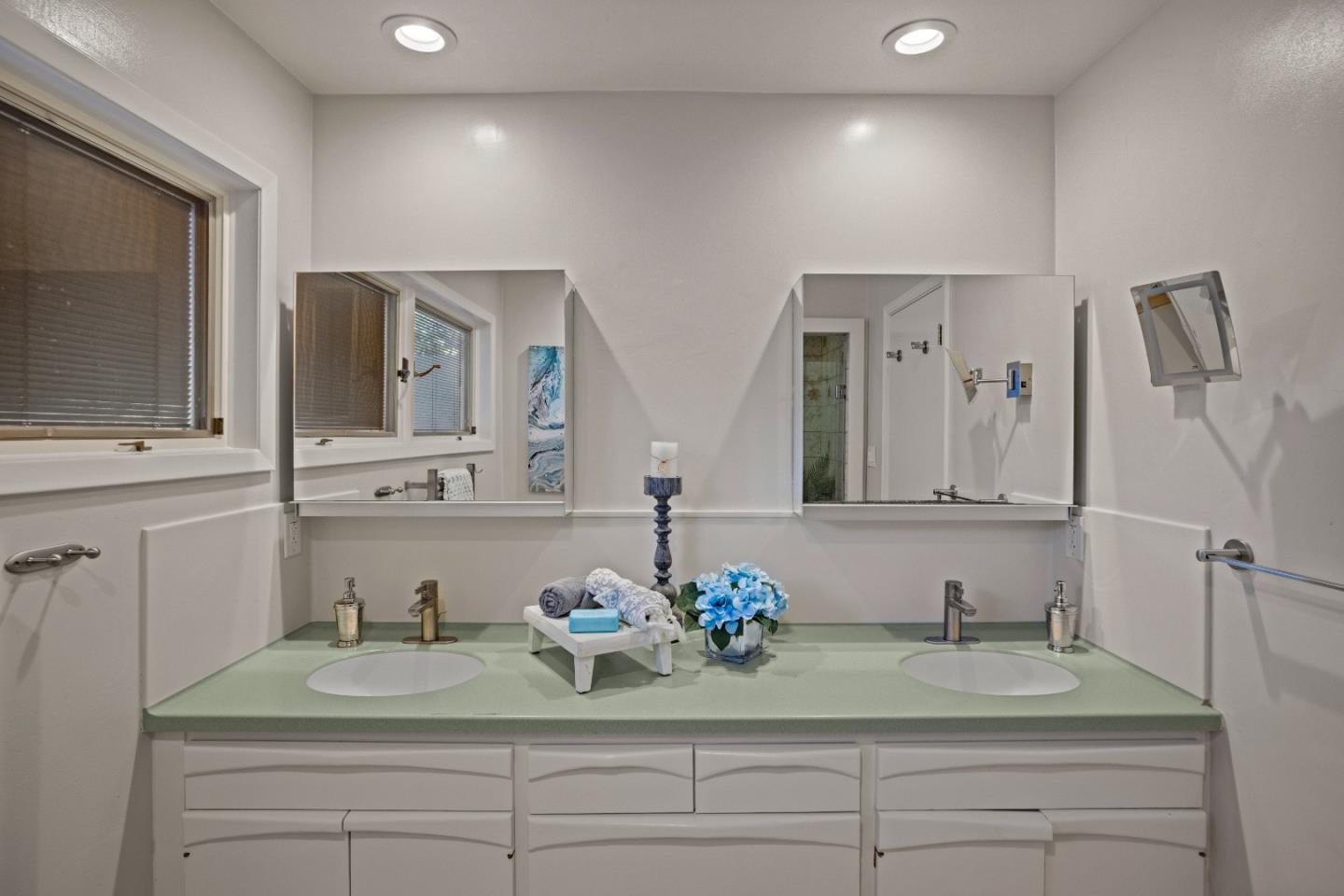 1390 Weston Ridge Road Scotts Valley, CA 95066 - Photo 20 of 55 a bathroom with double vanity sinks and a mirror