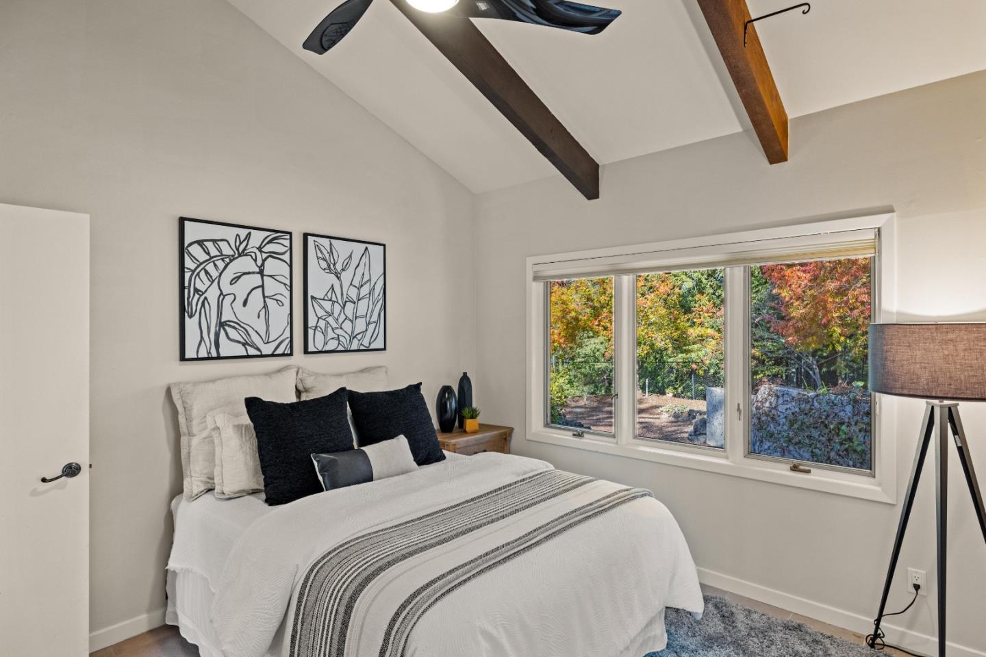 1390 Weston Ridge Road Scotts Valley, CA 95066 - Photo 28 of 55 a bedroom with a bed and a large window