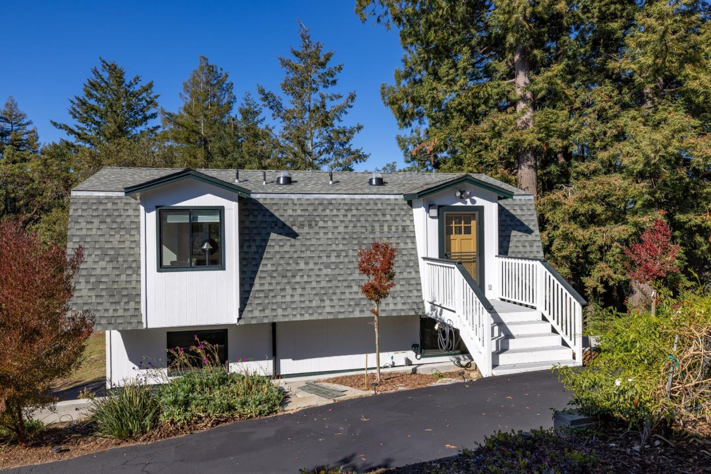 1390 Weston Ridge Road Scotts Valley, CA 95066 - Photo 29 of 55 a front view of a house with a yard garage and outdoor seating
