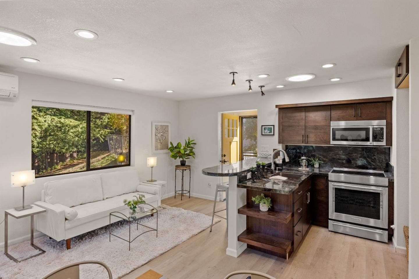 1390 Weston Ridge Road Scotts Valley, CA 95066 - Photo 30 of 55 a living room with furniture a flat screen tv and a large window
