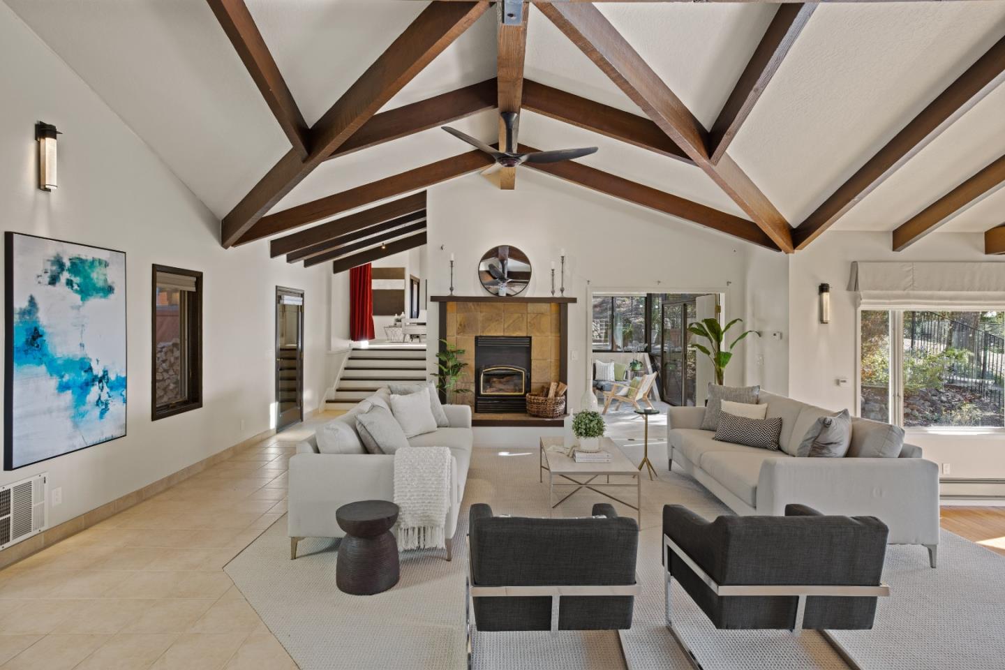 1390 Weston Ridge Road Scotts Valley, CA 95066 - Photo 4 of 55 a living room with furniture a fireplace and a ceiling fan