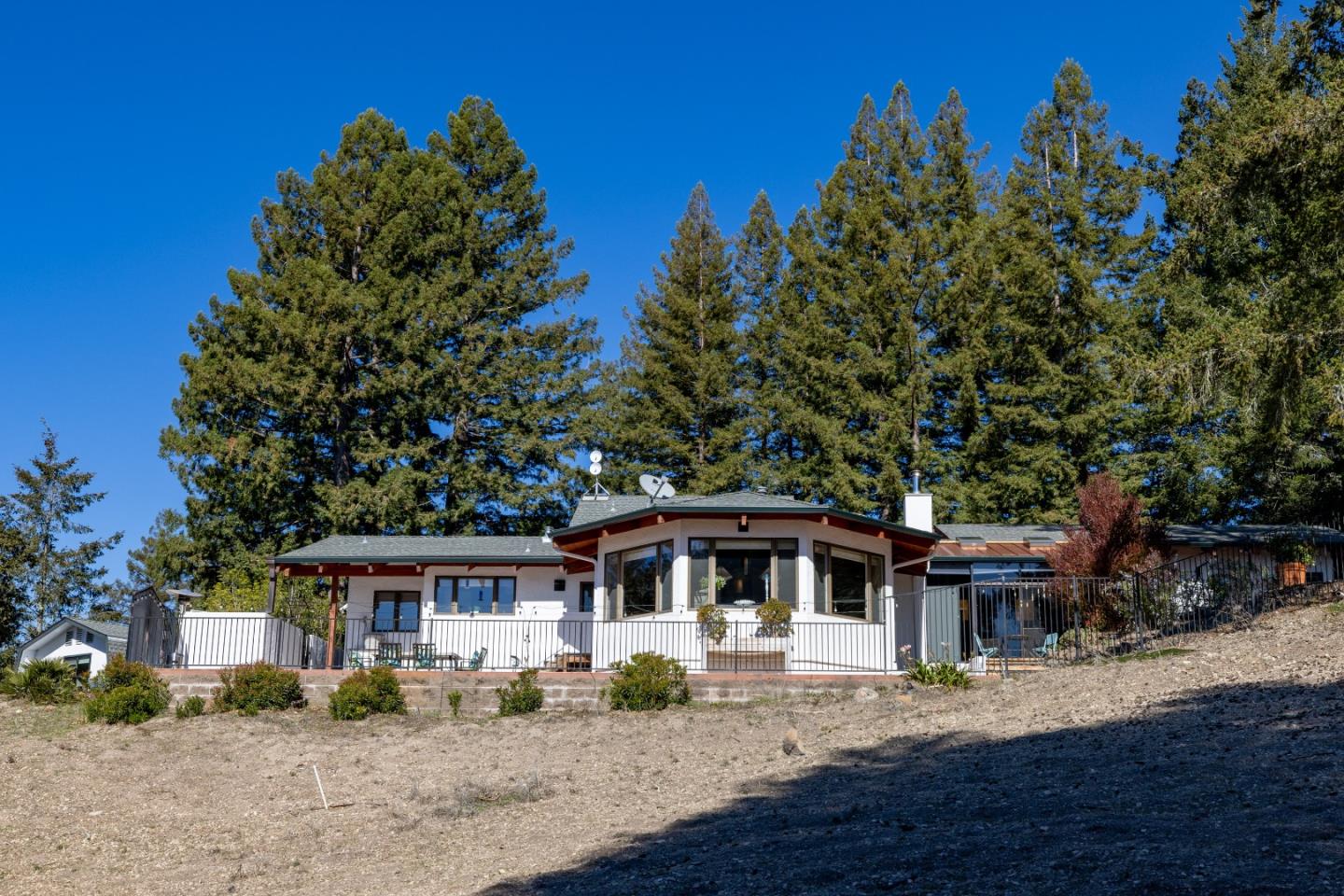 1390 Weston Ridge Road Scotts Valley, CA 95066 - Photo 49 of 55 a front view of a house with a garden