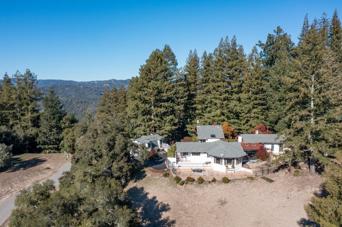 1390 Weston Ridge Road Scotts Valley, CA 95066 - Photo 53 of 55 a wooden bench sitting in the middle of a field