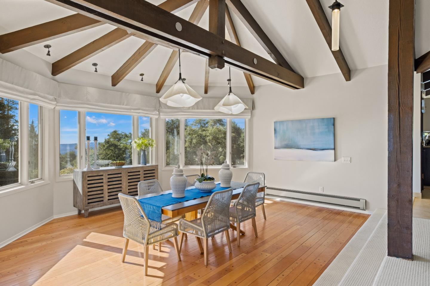 1390 Weston Ridge Road Scotts Valley, CA 95066 - Photo 7 of 55 a dining room with furniture a rug and a large window
