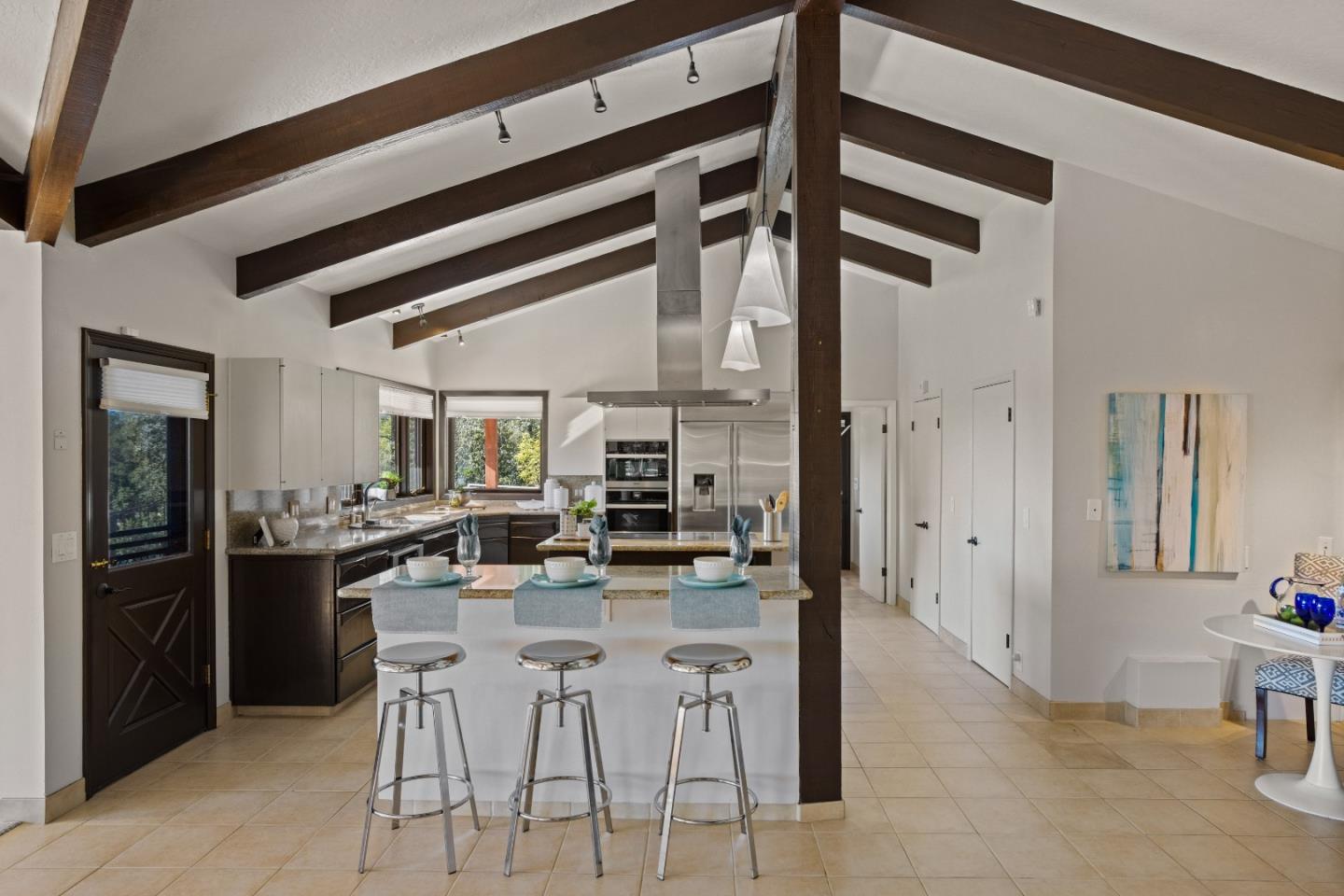 1390 Weston Ridge Road Scotts Valley, CA 95066 - Photo 8 of 55 a kitchen with stainless steel appliances kitchen island granite countertop a refrigerator and cabinets