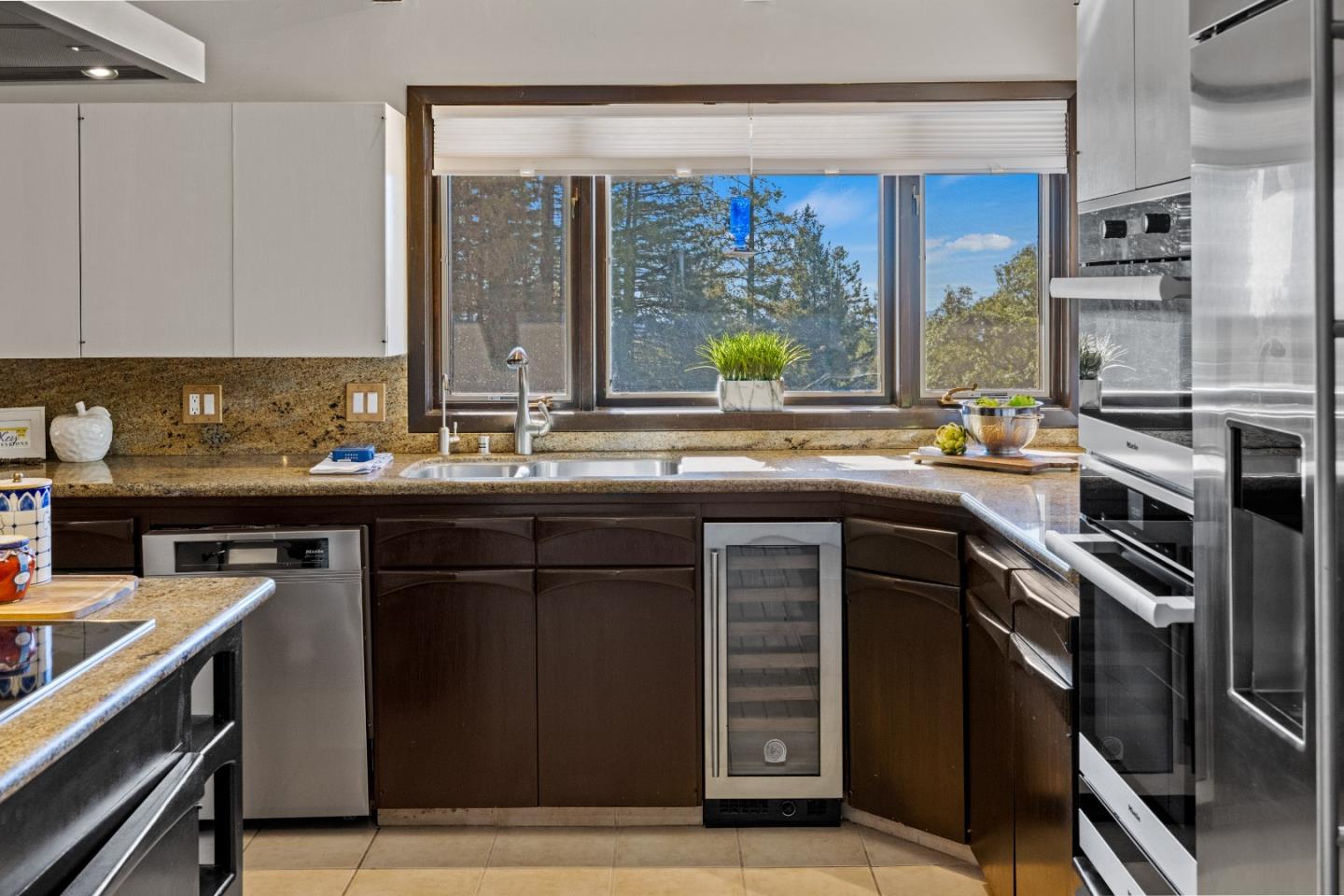 1390 Weston Ridge Road Scotts Valley, CA 95066 - Photo 10 of 55 a kitchen with stainless steel appliances a sink stove and cabinets