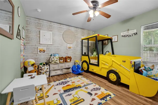 a bedroom with bed and window