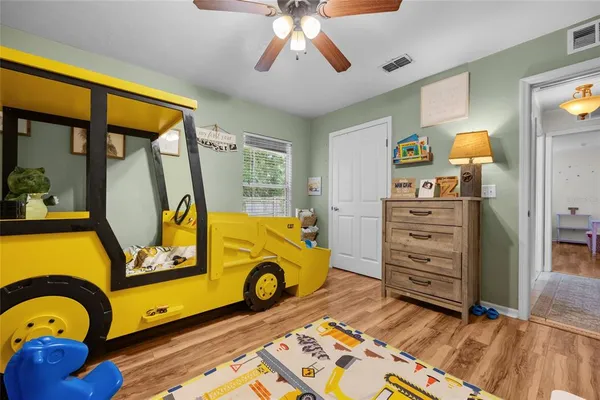 a room with dresser and window