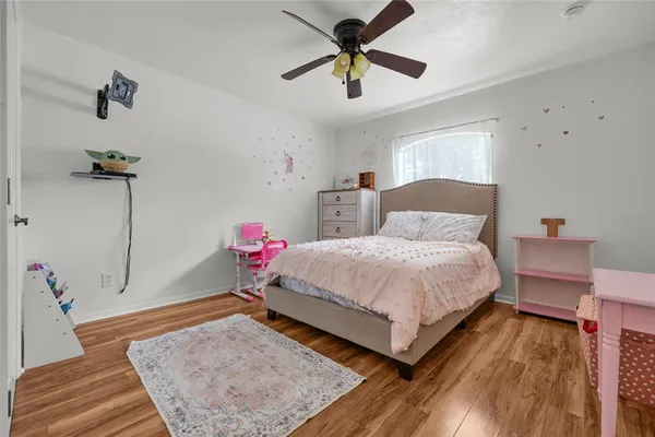 a bedroom with a bed and a dresser