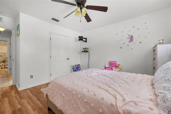 a bedroom with a bed and a dresser
