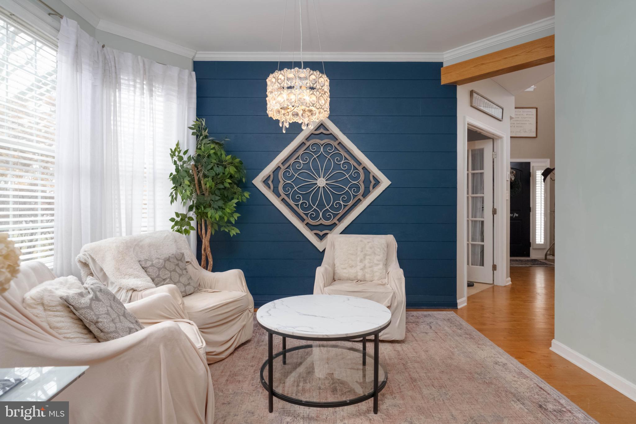 639 Old Orchard Road Bel Air, MD 21014 - Photo 15 of 46 a living room with furniture a chandelier and a window