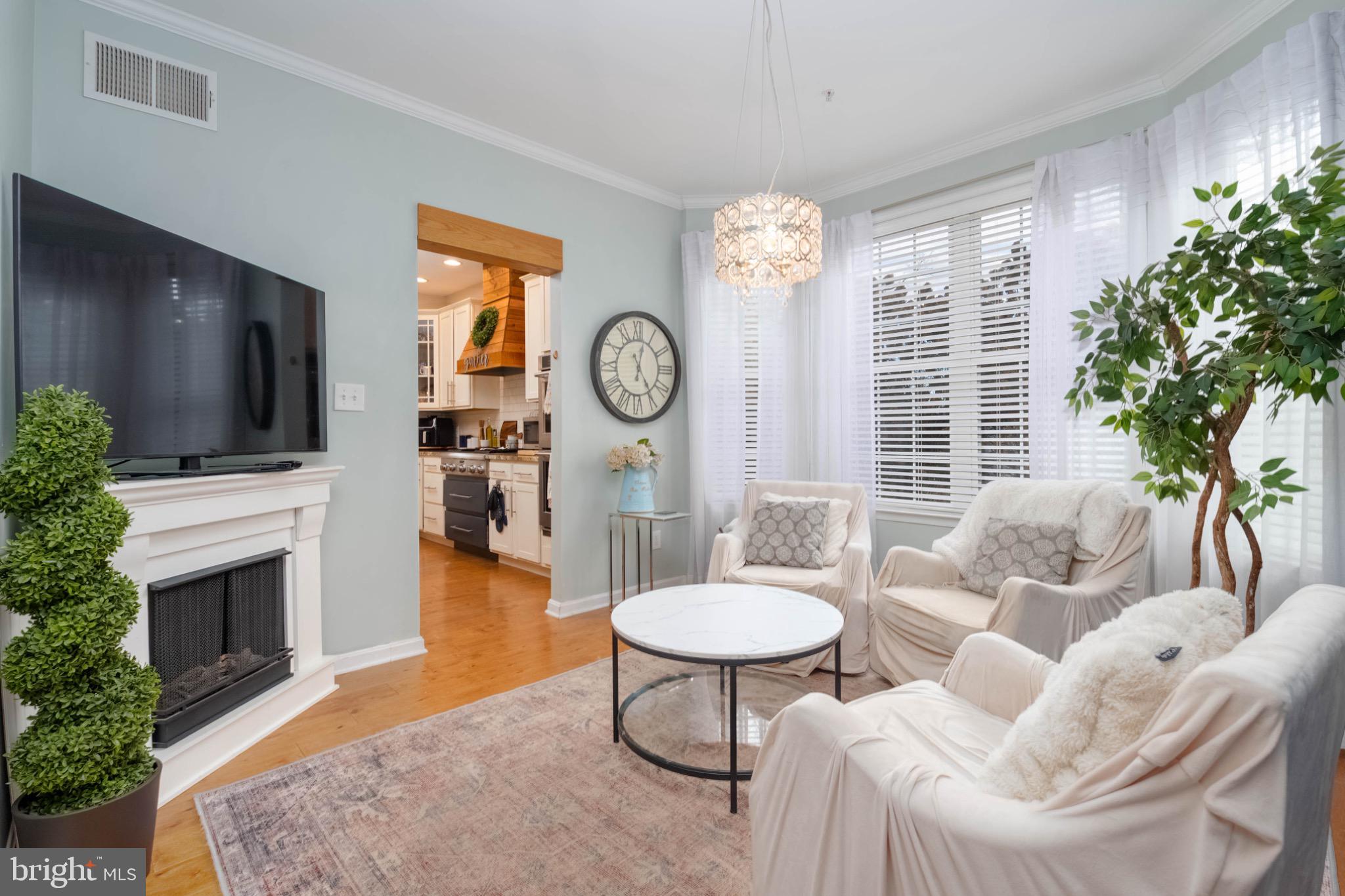639 Old Orchard Road Bel Air, MD 21014 - Photo 16 of 46 a living room with fireplace furniture and a flat screen tv