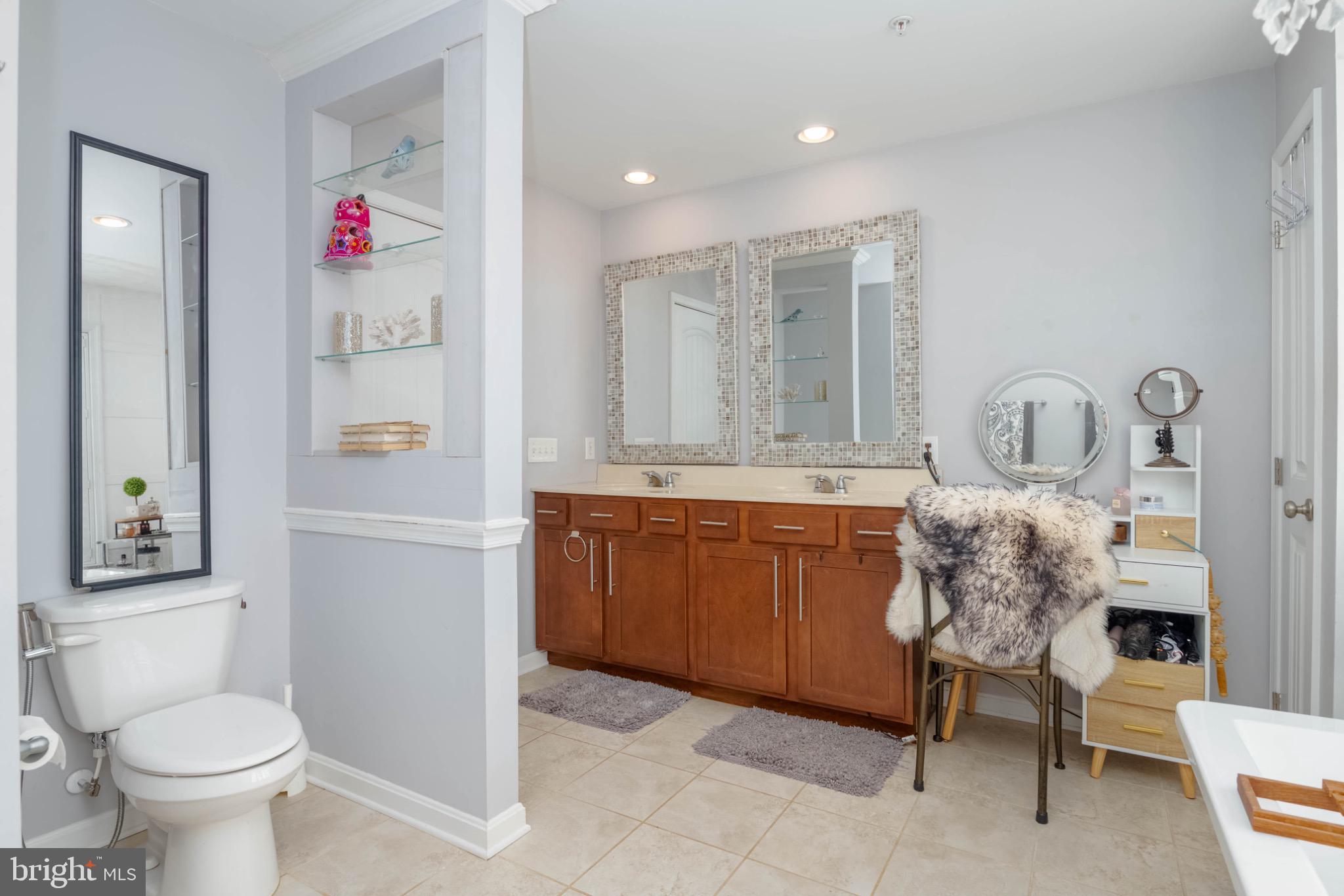 639 Old Orchard Road Bel Air, MD 21014 - Photo 24 of 46 a bathroom with a toilet sink vanity and mirror