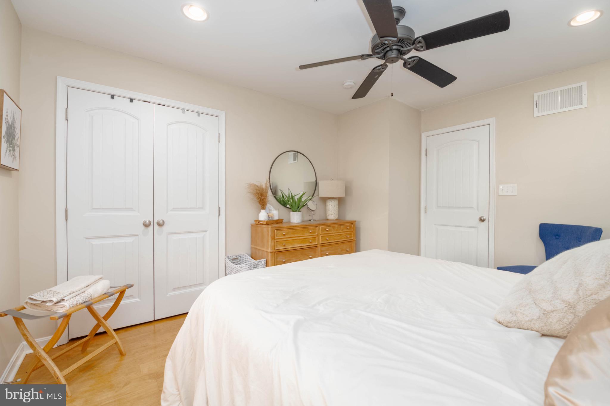 639 Old Orchard Road Bel Air, MD 21014 - Photo 28 of 46 a bedroom with a bed and a chandelier