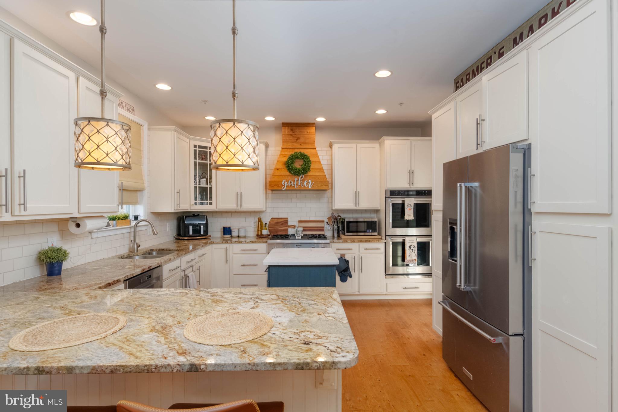 639 Old Orchard Road Bel Air, MD 21014 - Photo 5 of 46 a kitchen with granite countertop a refrigerator oven a sink and cabinets
