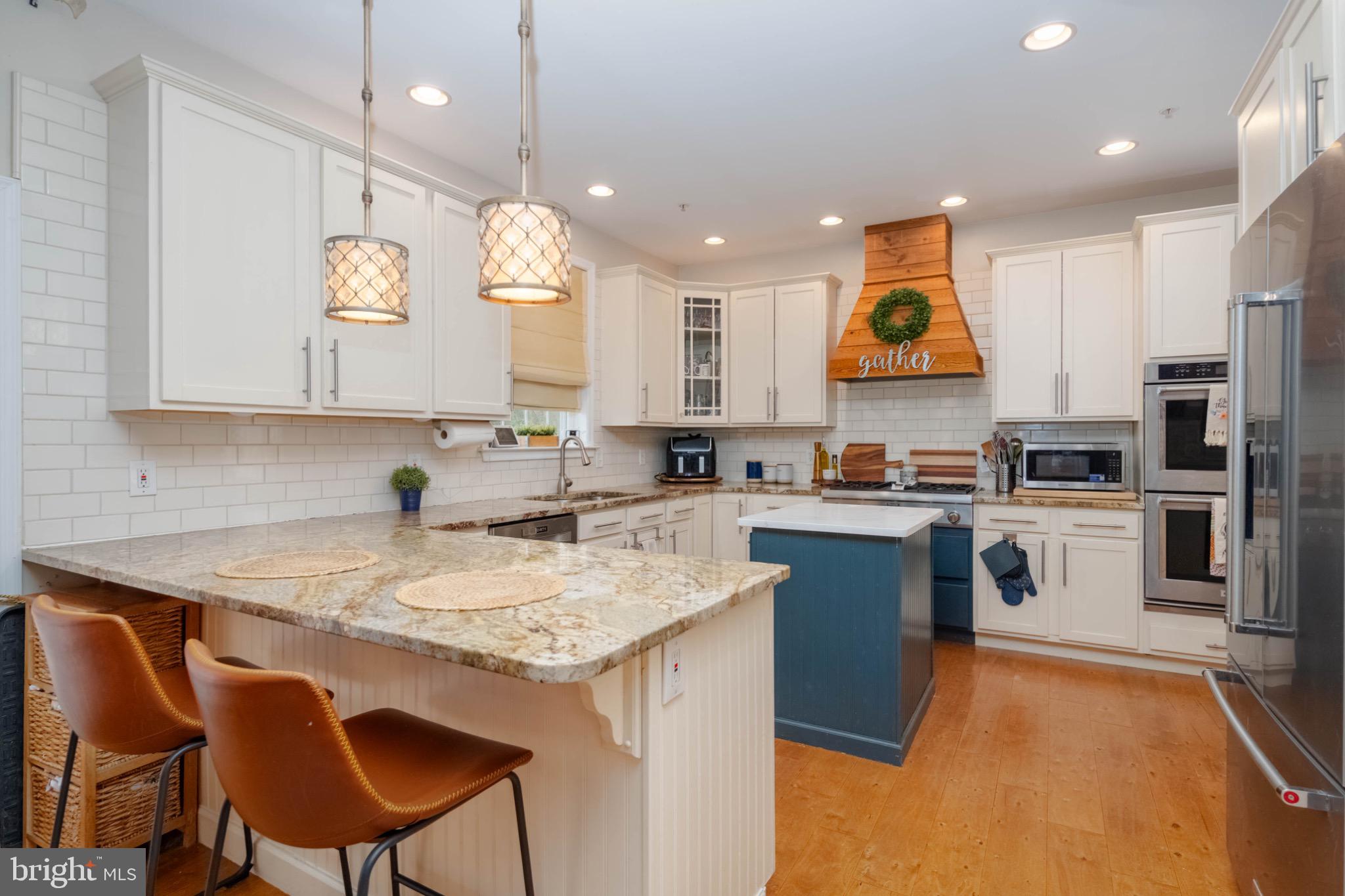 639 Old Orchard Road Bel Air, MD 21014 - Photo 7 of 46 a kitchen with a sink a counter top space cabinets and stainless steel appliances