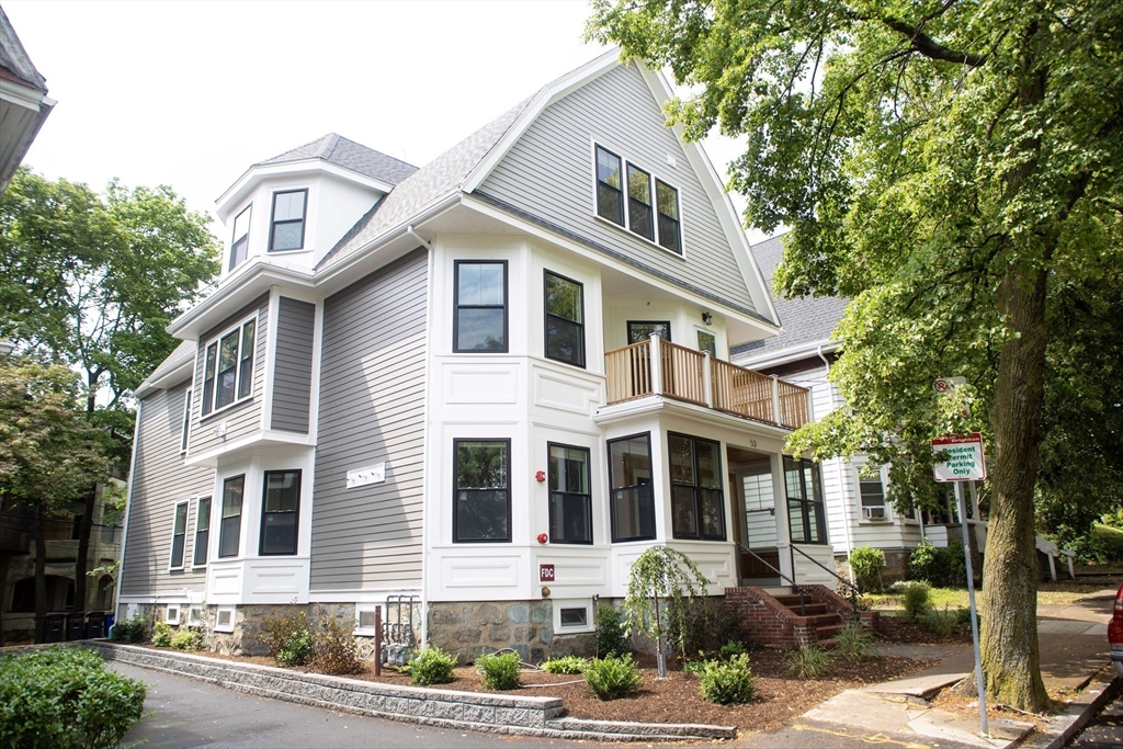 53 Quint Avenue, Unit 3 Boston, MA 02134 - Photo 1 of 18 a front view of a house with a yard