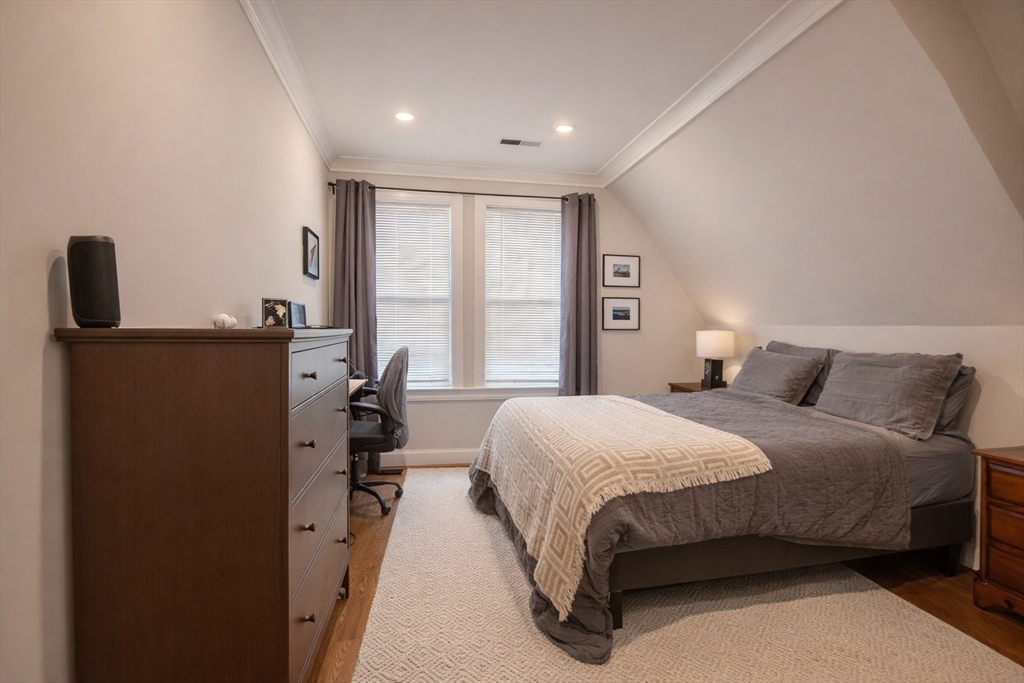 53 Quint Avenue, Unit 3 Boston, MA 02134 - Photo 13 of 18 a spacious bedroom with a bed and a large window