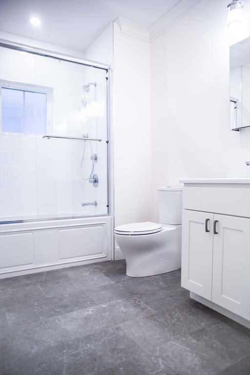 53 Quint Avenue, Unit 3 Boston, MA 02134 - Photo 18 of 18 a bathroom with a toilet and a shower