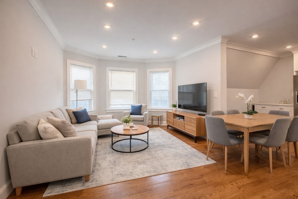 53 Quint Avenue, Unit 3 Boston, MA 02134 - Photo 4 of 18 a living room with furniture and a flat screen tv