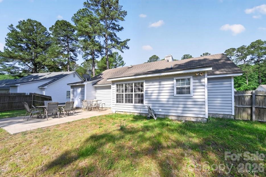2205 Old Sparta Road Rocky Mount, NC 27804 - Photo 24 of 25 a front view of house with yard and trees in the background