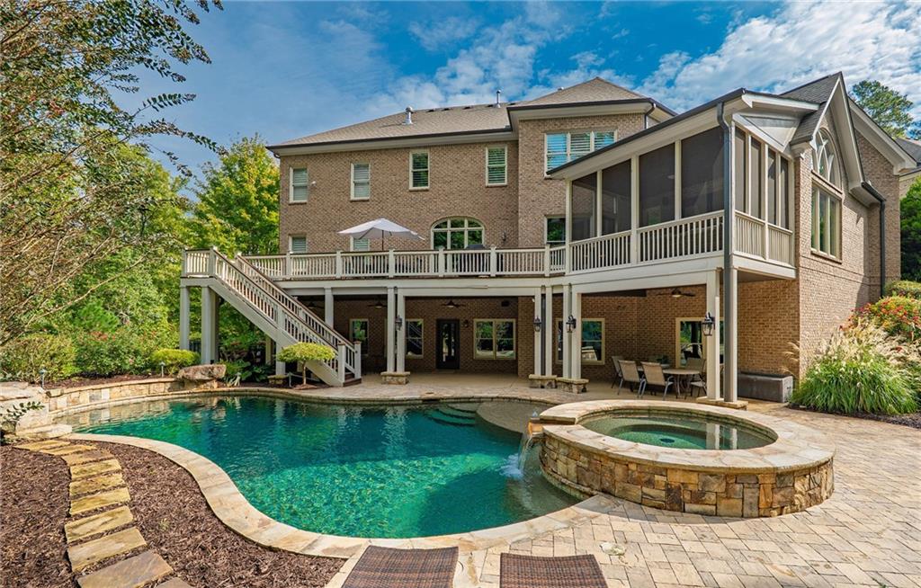 16750 Quayside Drive Milton, GA 30004 - Photo 2 of 53 a view of a house with roof deck and sitting area
