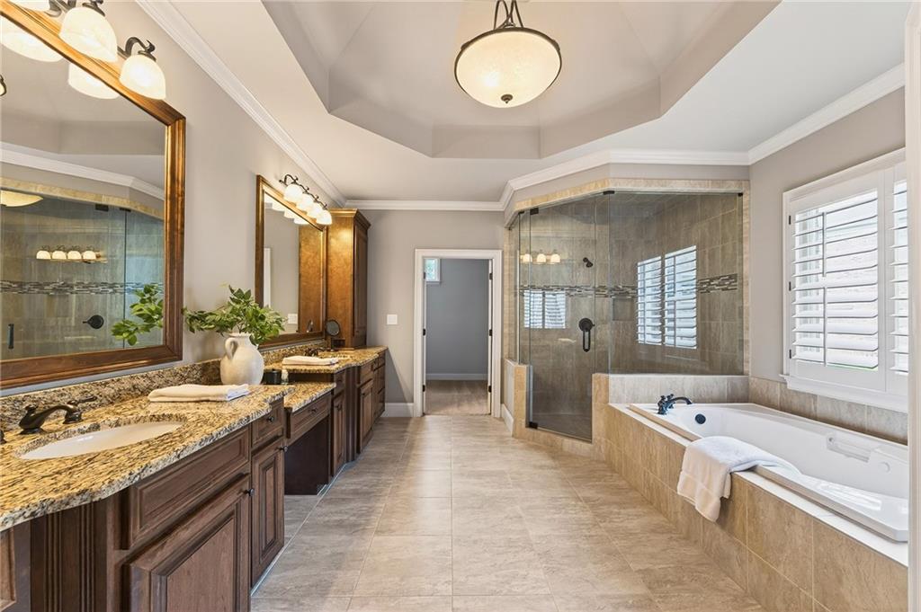 16750 Quayside Drive Milton, GA 30004 - Photo 21 of 53 a large bathroom with a large tub and sink