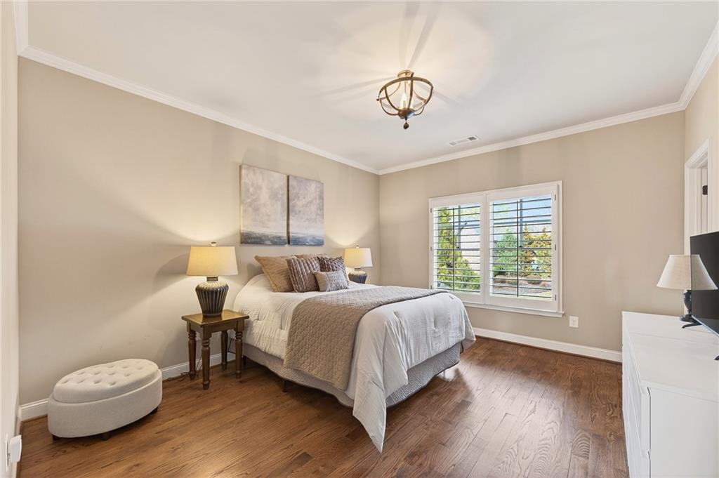 16750 Quayside Drive Milton, GA 30004 - Photo 25 of 53 a bedroom with a bed and a window
