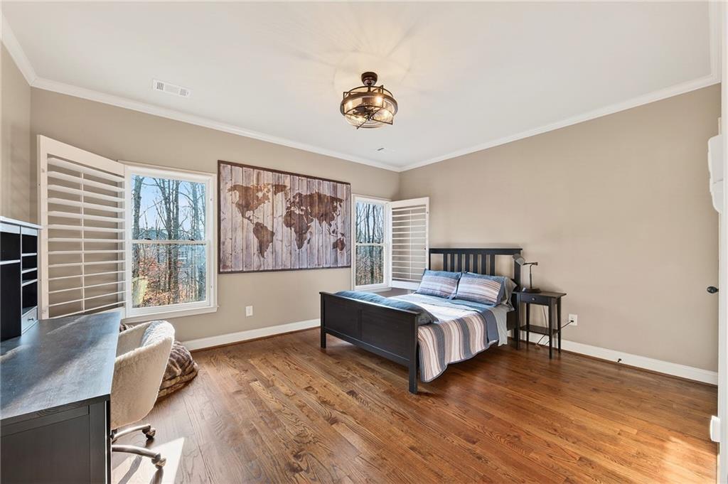 16750 Quayside Drive Milton, GA 30004 - Photo 27 of 53 a bedroom with a bed and wooden floor