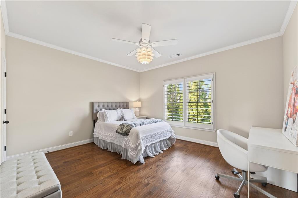 16750 Quayside Drive Milton, GA 30004 - Photo 29 of 53 a spacious bedroom with a bed and a couch