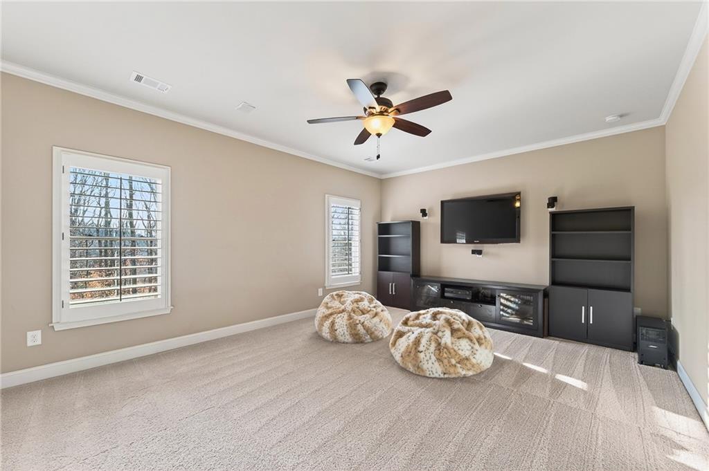 16750 Quayside Drive Milton, GA 30004 - Photo 31 of 53 a bedroom with furniture and a flat screen tv