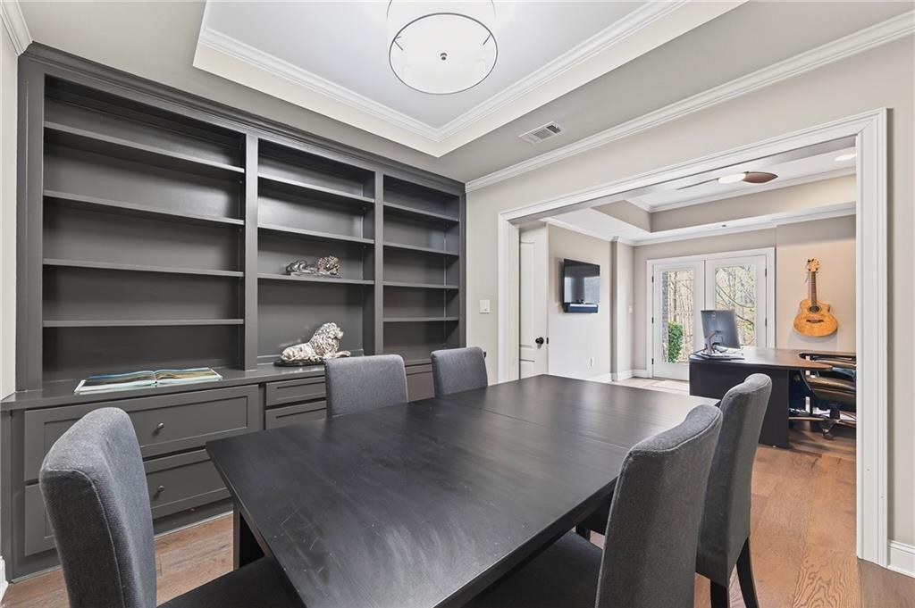 16750 Quayside Drive Milton, GA 30004 - Photo 39 of 53 a view of a dining room with furniture and wooden floor